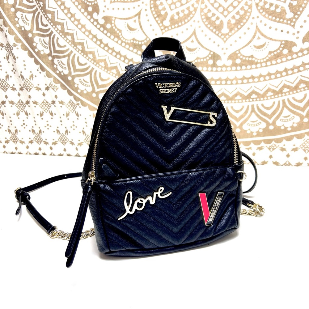 Victoria’s Secret black mini backpack. Golden accents. Pockets. Excellent cond